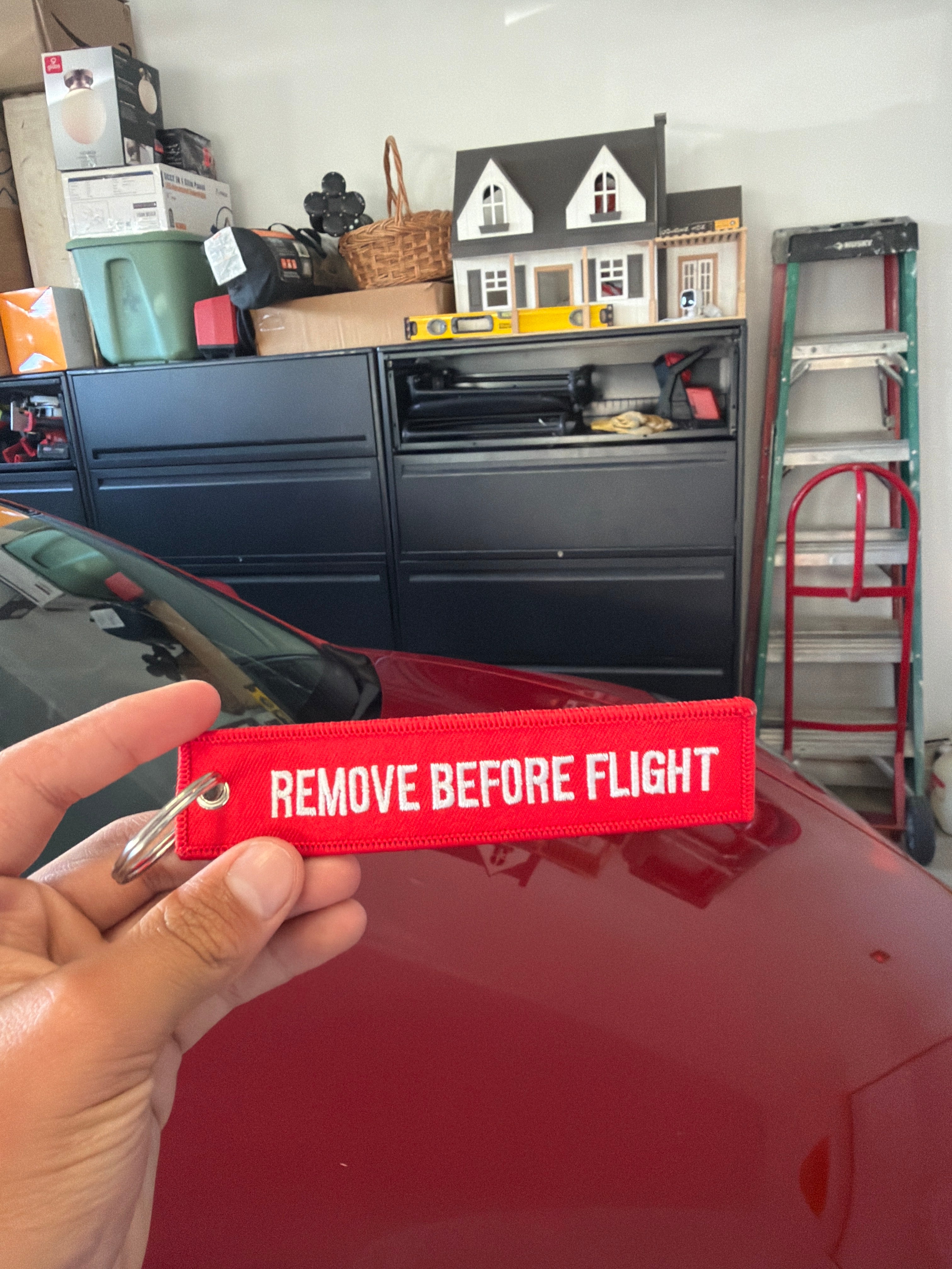 Remove before flight keychain